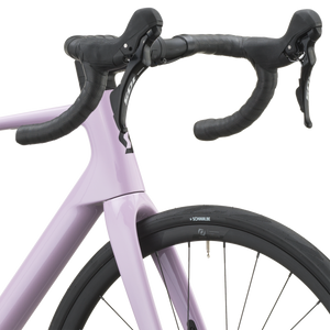 Cockpit of the mallow pink Scott Addict 50 with taped drop bars and Shimano 105 shifters.