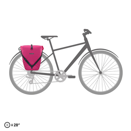 Cyber pink waterproof Ortlieb Back-Roller 20L pannier bag attached to rear rack of black bicycle.