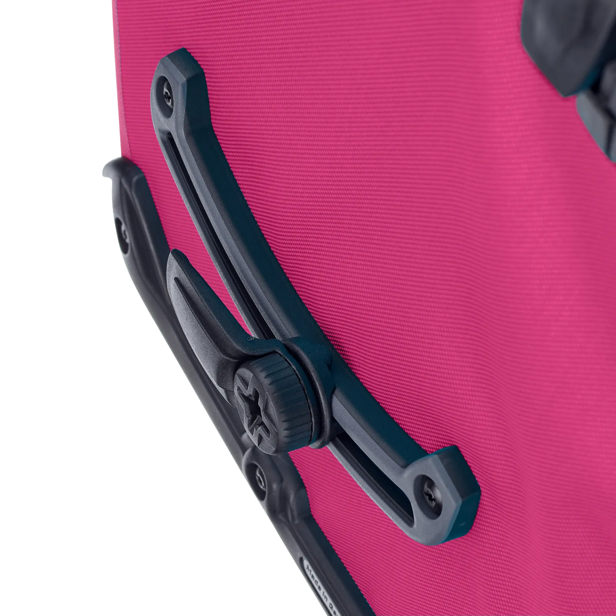 Close-up of the black mounting bracket and attachment knob on a cyber pink Ortlieb Back-Roller pannier bag.