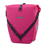 Cyber pink waterproof Ortlieb Back-Roller 20L pannier bag with black adjustable straps and reflective side patch.