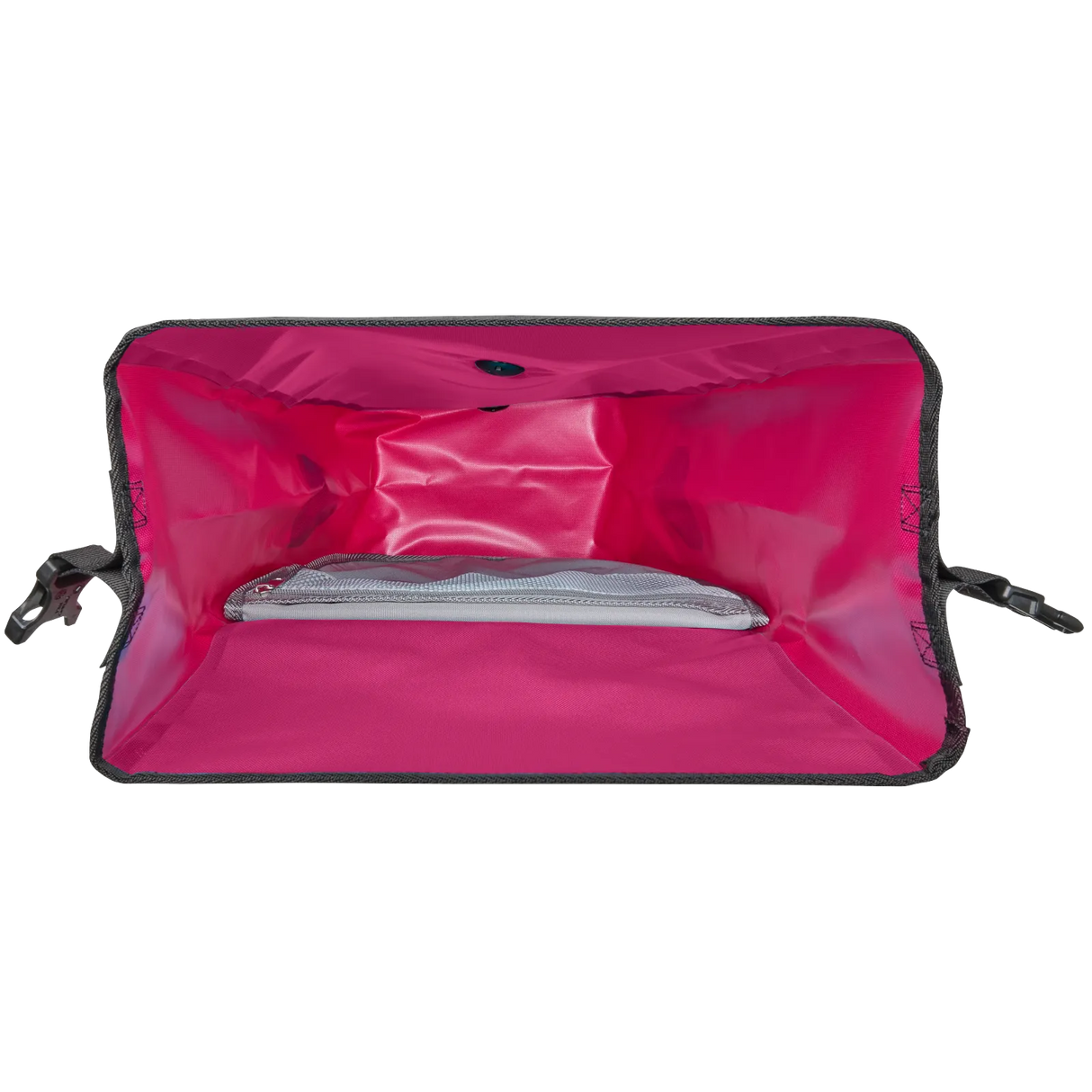 Open bright pink waterproof pannier bag showing spacious main compartment with mesh pocket inside.
