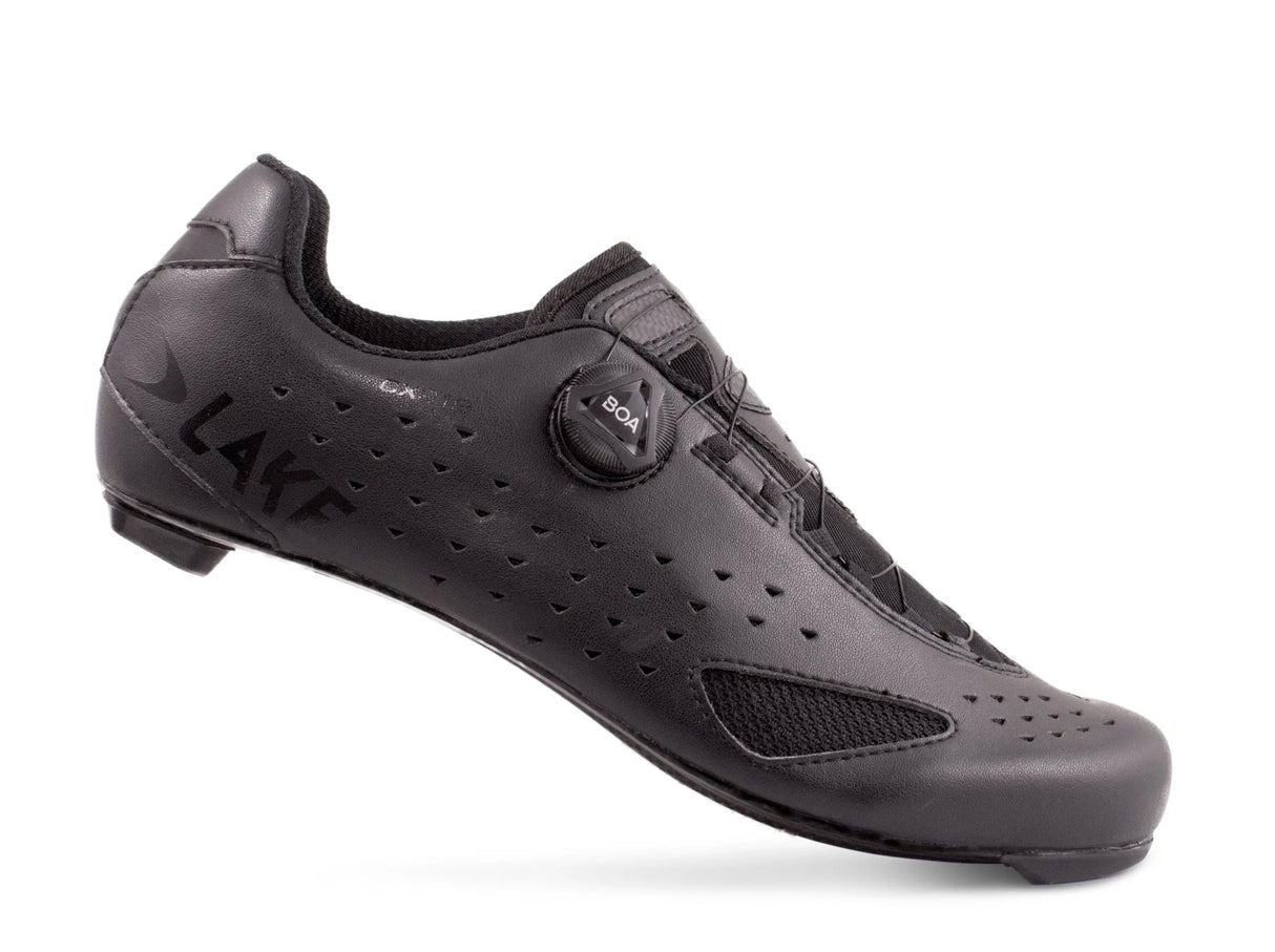 Side view of Lake CX219 Road Shoe in black, showing sleek profile, mesh ventilation, and lightweight construction for road cycling.