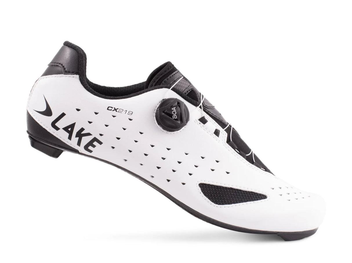 Side view of white Lake CX219 Road Shoe with perforated upper and carbon sole, ideal for road cyclists seeking speed and comfort.
