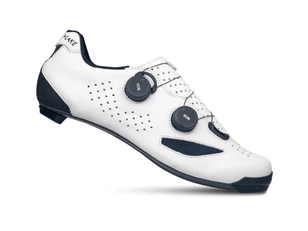 White cycling shoe with black accents on a white background