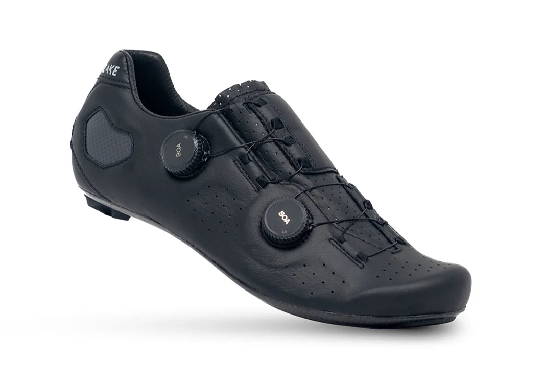 Black cycling shoe with unique sole design on a white background