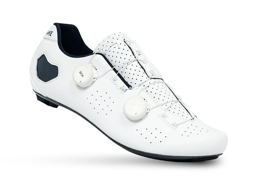White cycling shoe with black accents on a white background