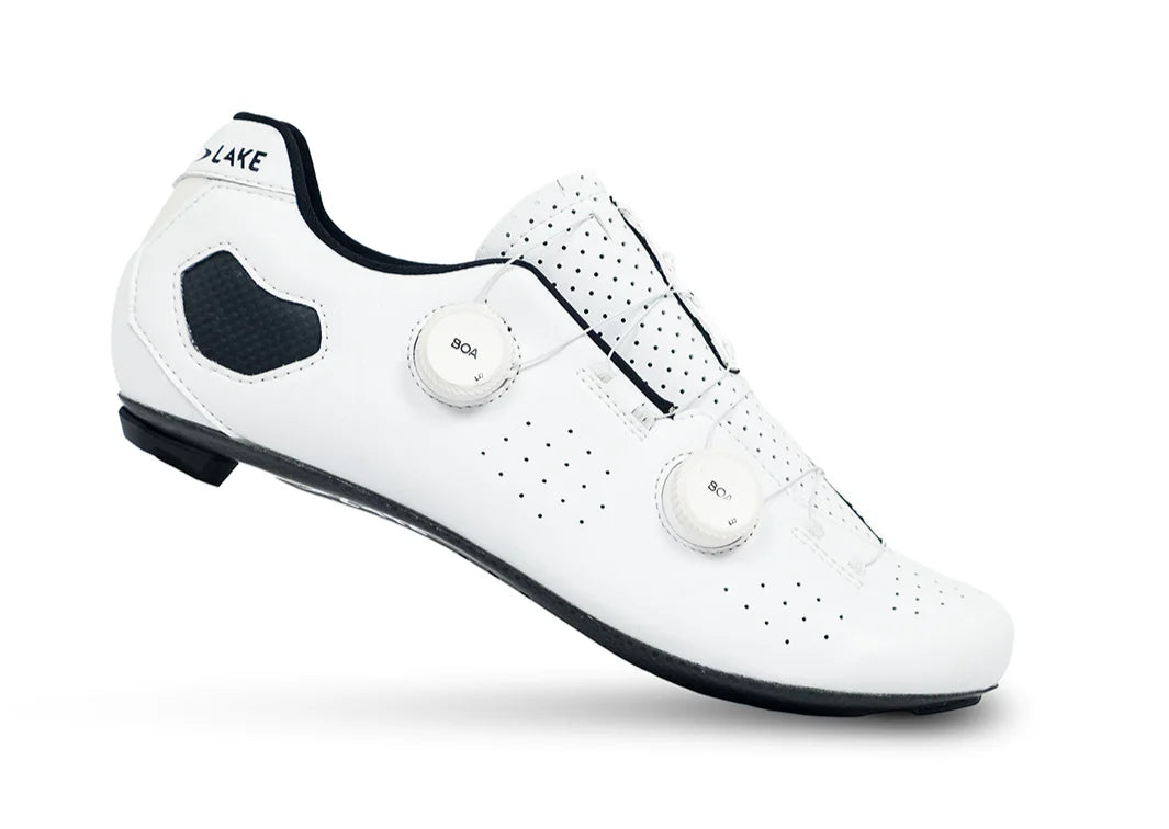 White cycling shoe with black accents on a white background