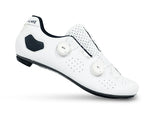 White cycling shoe with black accents on a white background