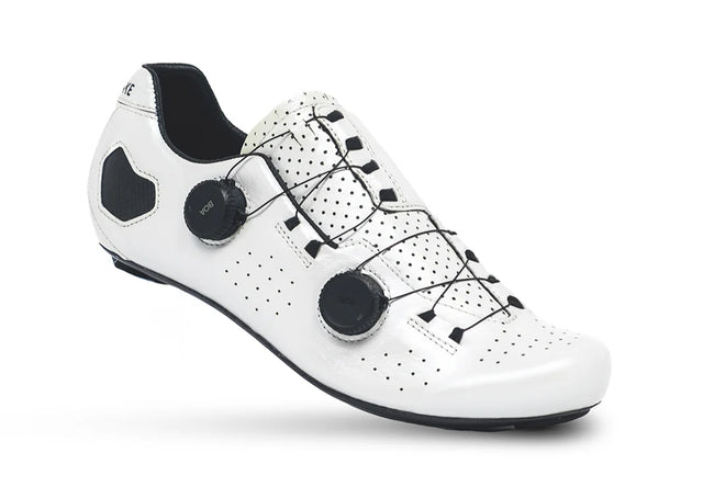 White cycling shoe with black accents on a white background