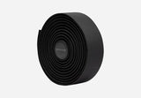 Rolled black Cannondale KnurlTack bar tape