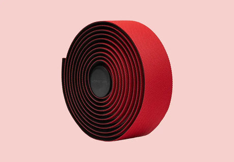 Rolled red Cannondale KnurlTack bar tape