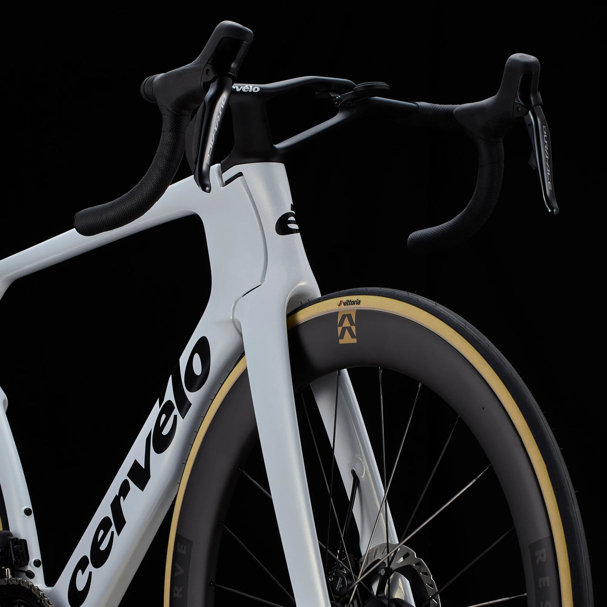 Front fork and cockpit of white Cervélo S5 Dura-Ace Di2 Road Bike with integrated handlebars and Reserve wheels for elite-level road cycling.