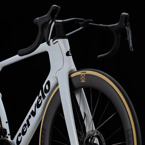 Front fork and cockpit of white Cervélo S5 Dura-Ace Di2 Road Bike with integrated handlebars and Reserve wheels for elite-level road cycling.