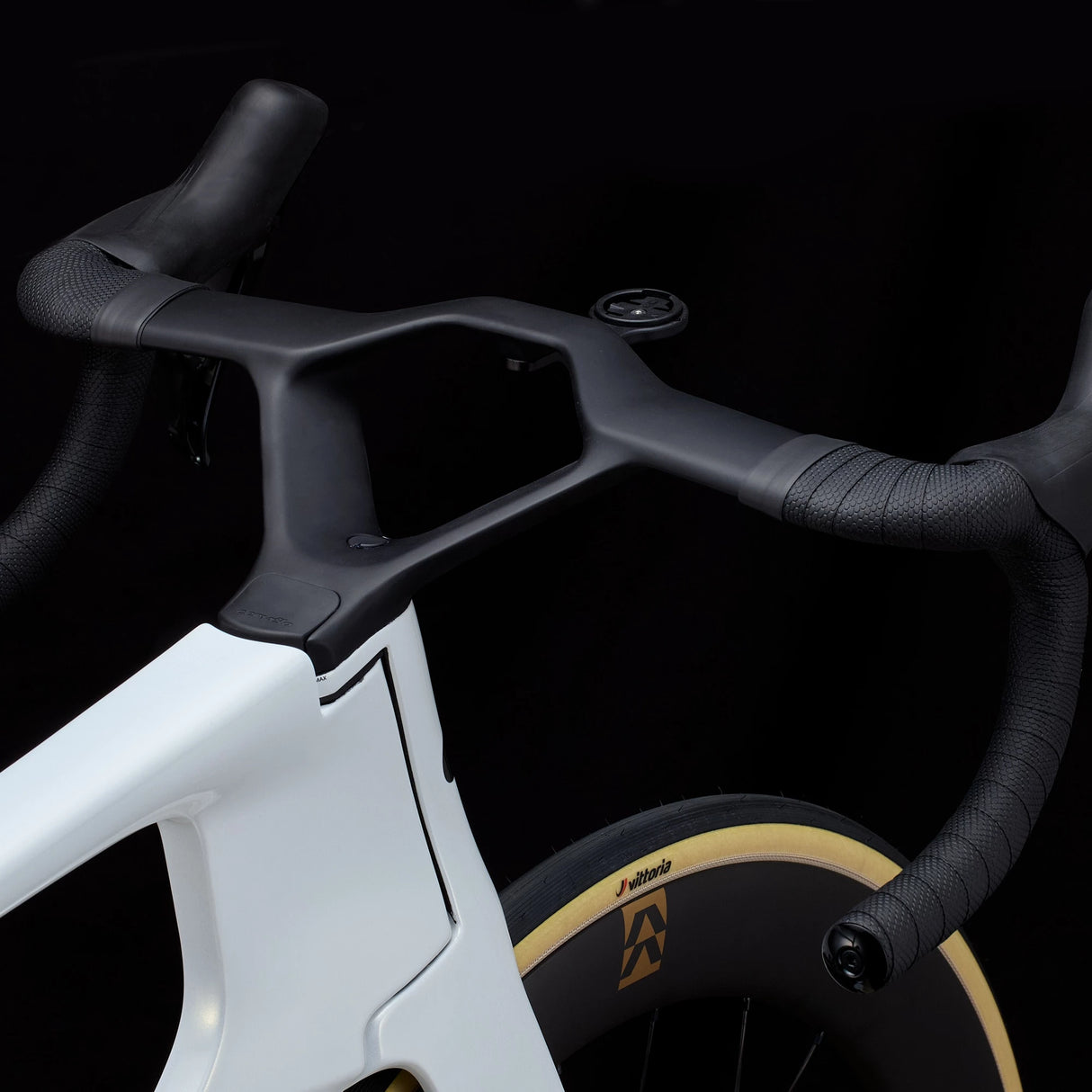 Detail of white Cervélo S5 Dura-Ace Di2 Road Bike cockpit with aero handlebars and internal routing, built for aerodynamic road racing performance.
