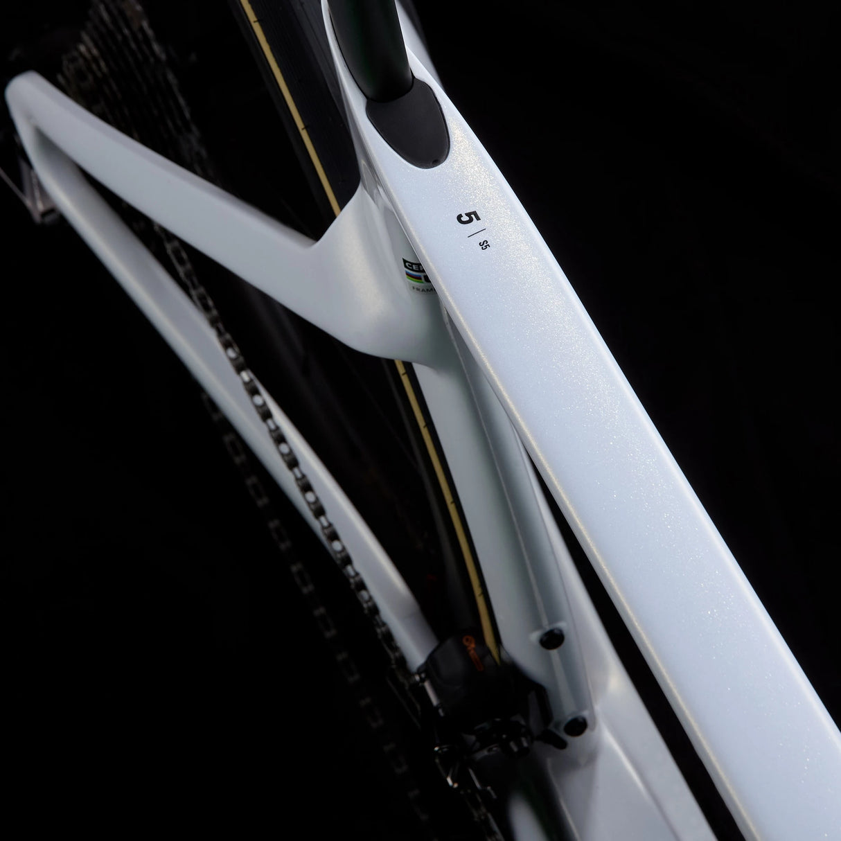 Top tube view of white Cervélo S5 Dura-Ace Di2 Road Bike showing carbon frame finish and internal cable routing for a clean, aerodynamic profile.