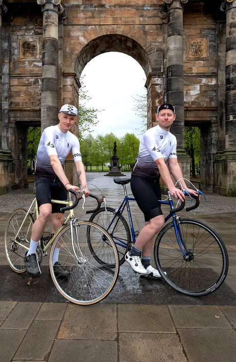 Cyclists pose with vintage bikes wearing the 45th Anniversary Short Sleeve Mens Jersey, celebrating Billy Bilsland Cycles' legacy in Glasgow.