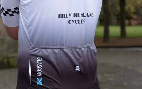 Rear pocket detail of the 45th Anniversary Short Sleeve Mens Jersey featuring 'GLASGOW' text and Scottish flag graphic.
