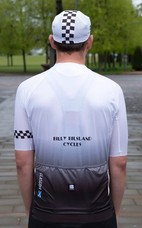 Back view of the 45th Anniversary Short Sleeve Mens Jersey with checkered sleeve, triple rear pockets, and Billy Bilsland Cycles text.