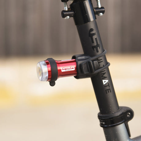 Exposure BoostR Mk3 rear light clamped to a seatpost, seen from the side