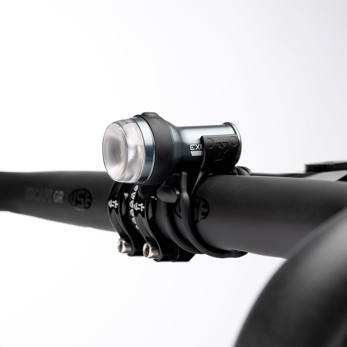 Exposure Trace Mk4 front light clamped to a handlebar