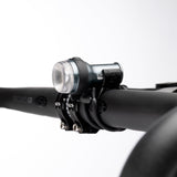 Exposure Trace Mk4 front light clamped to a handlebar