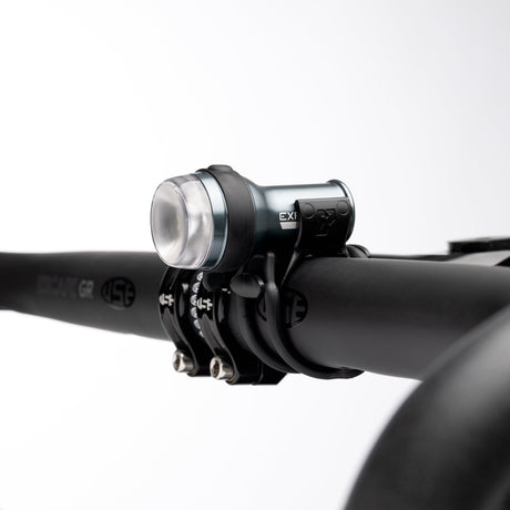 Exposure Trace Mk4 front light clamped to a handlebar