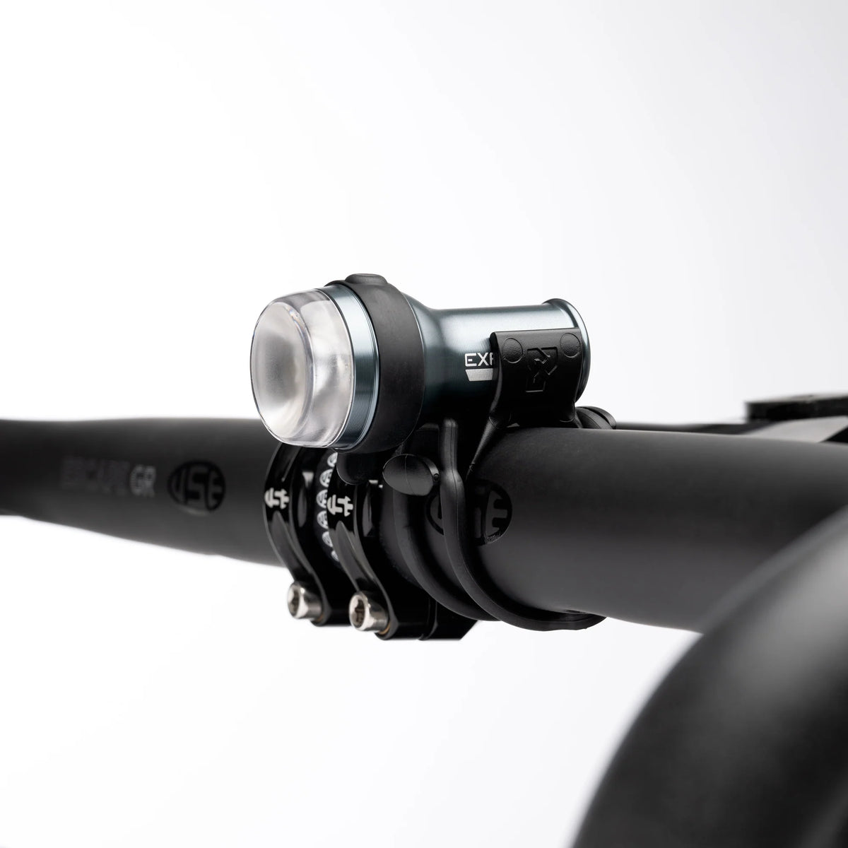Exposure Trace Mk4 front light clamped to a handlebar
