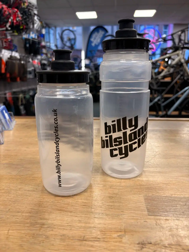 Bilsland Bottle Fly CLR transparent cycling bottle with black cap, featuring Billy Bilsland Cycles branding. Ideal for hydration on bike rides.