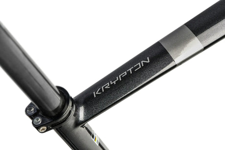 Close-up of a bicycle frame with 'Krypton' branding on a white background