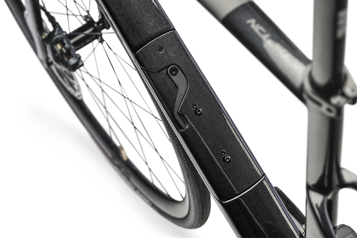 Close-up of a bicycle's suspension fork on a white background
