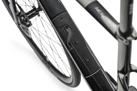 Close-up of a bicycle's suspension fork on a white background