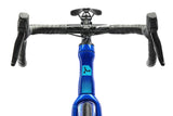 Close-up of a bicycle handlebar with blue frame and black grips on a white background