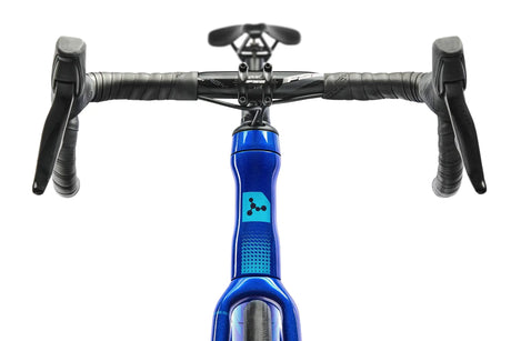 Close-up of a bicycle handlebar with blue frame and black grips on a white background