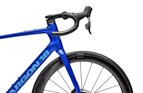 Blue bicycle with 'Argon 18' branding on a white background