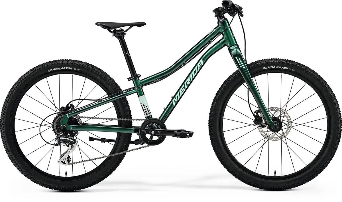 Merida Matts J.24+ Hybrid Kids Bike in green with lightweight frame, 24-inch wheels, and Kenda tires for outdoor cycling adventures.