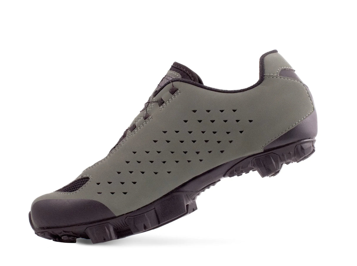 Gray sneaker with black sole on a white background