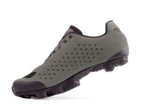 Gray sneaker with black sole on a white background