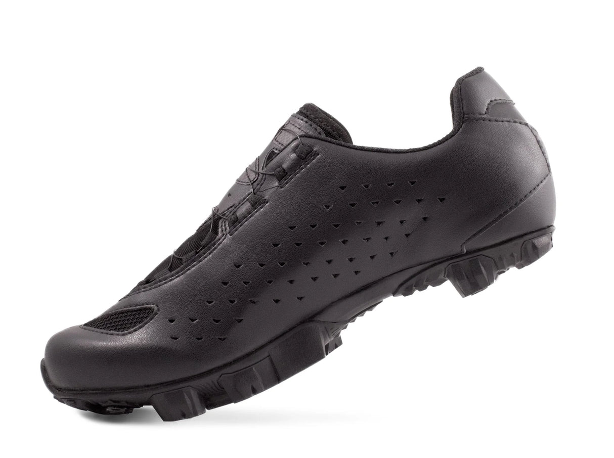 Black cycling shoe on a white background