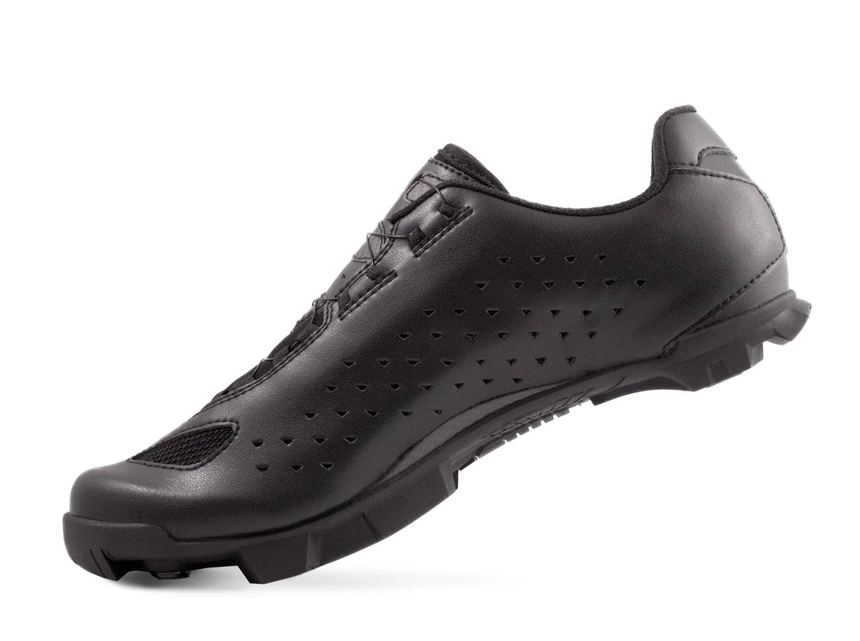 Rear angle of Lake MX219 Mountain Bike Shoe highlighting aerodynamic design and breathable leather upper for rugged off-road cycling.