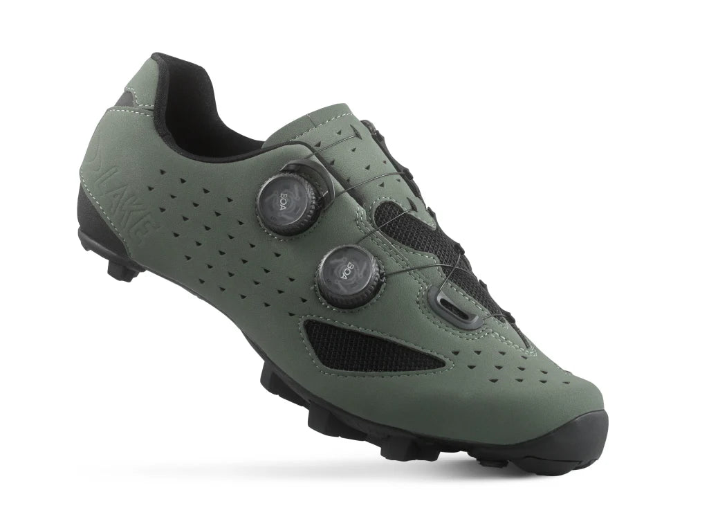 Green cycling shoe with black accents on a white background
