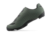Green cycling shoe with black sole on a white background
