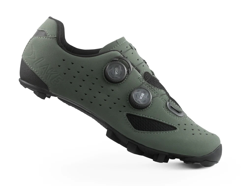 Green cycling shoe with black accents on a white background