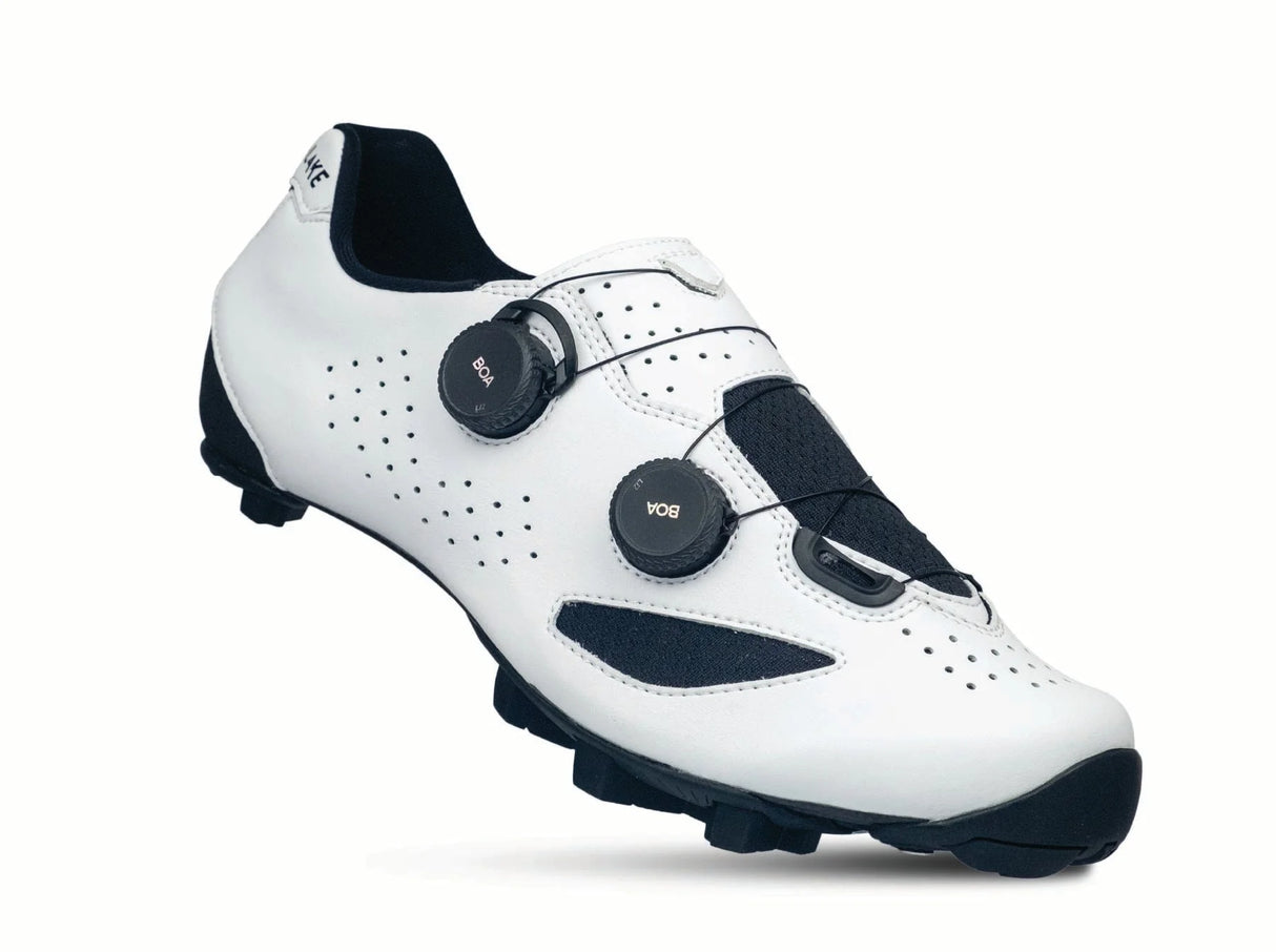 White cycling shoe with black accents on a white background
