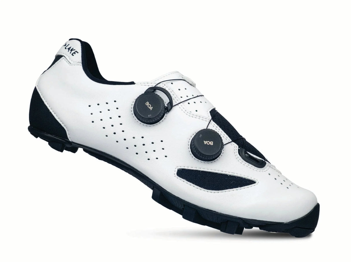 White cycling shoe with black accents on a white background