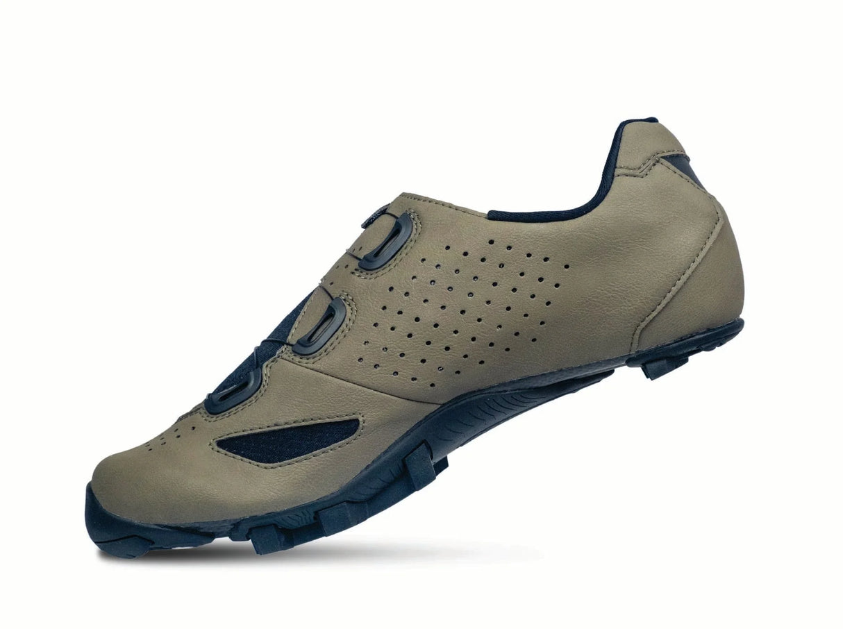 Beige cycling shoe with blue accents on a white background