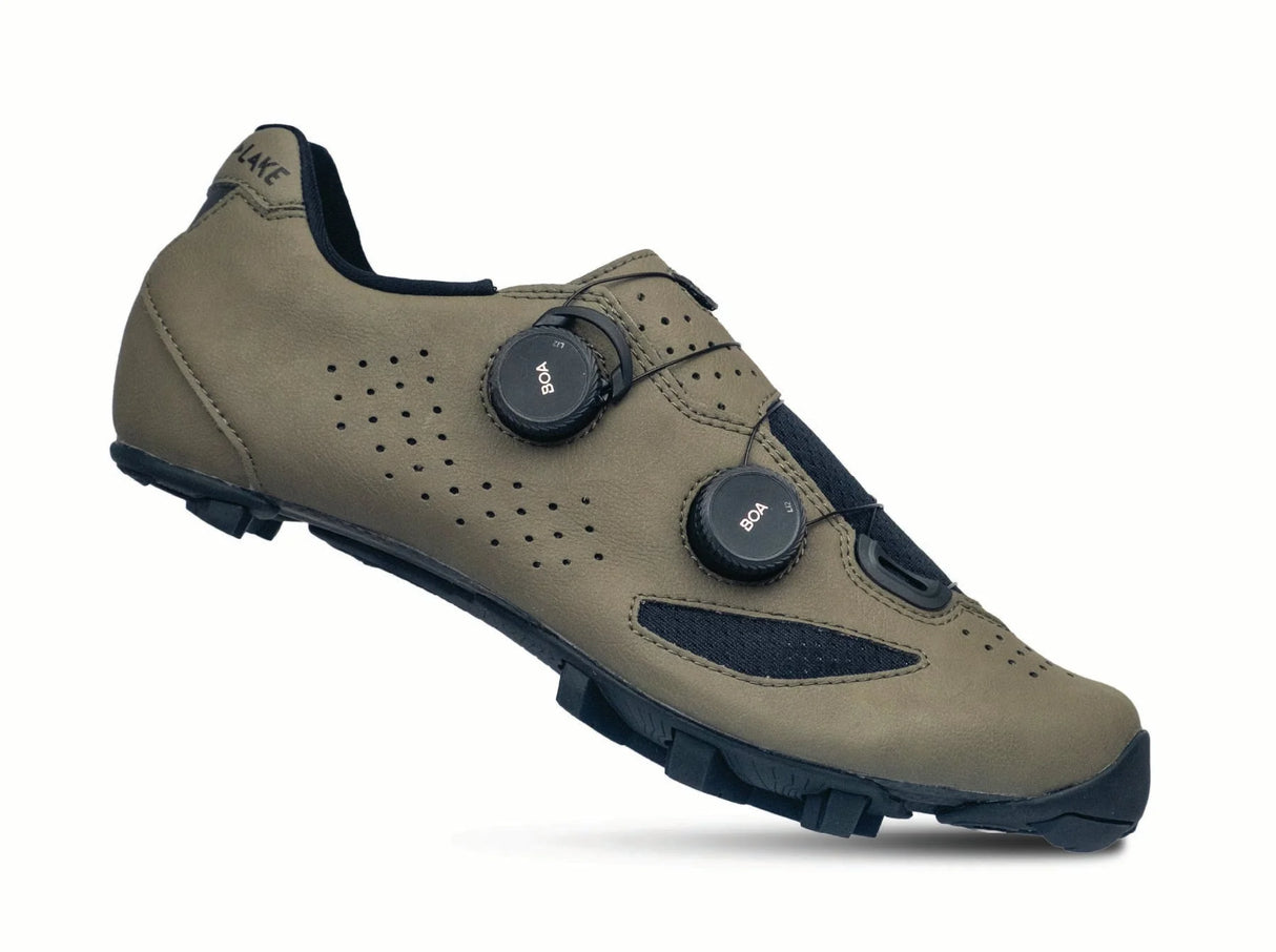 Brown cycling shoe with black accents on a white background