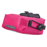 Compact cyber pink waterproof saddle bag with black mounting hardware and Ortlieb logo patch.