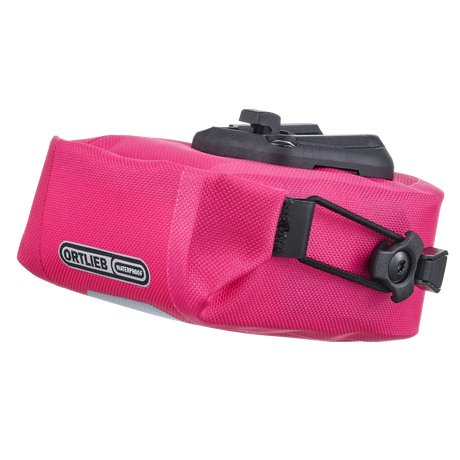 Compact cyber pink waterproof saddle bag with black mounting hardware and Ortlieb logo patch.