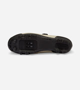 Sole of QUOC Escape Off-Road Shoe in sand color, showing aggressive tread and SPD cleat mount for off-road cycling.