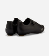 Rear view of black QUOC Escape Road Shoes showing heel support and reflective branding for visibility and safety.